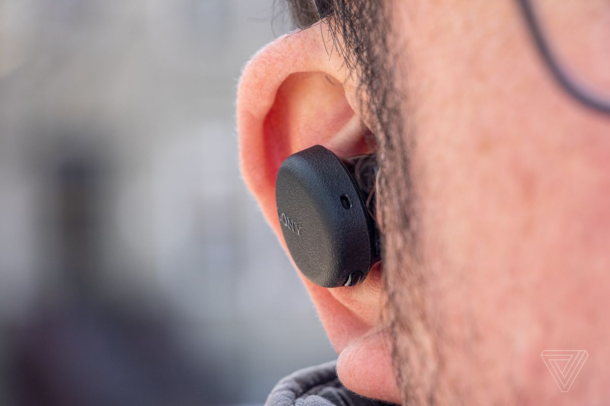 An image of the Sony WF-XB700, the best wireless earbuds for around 0, in someone’s ear.