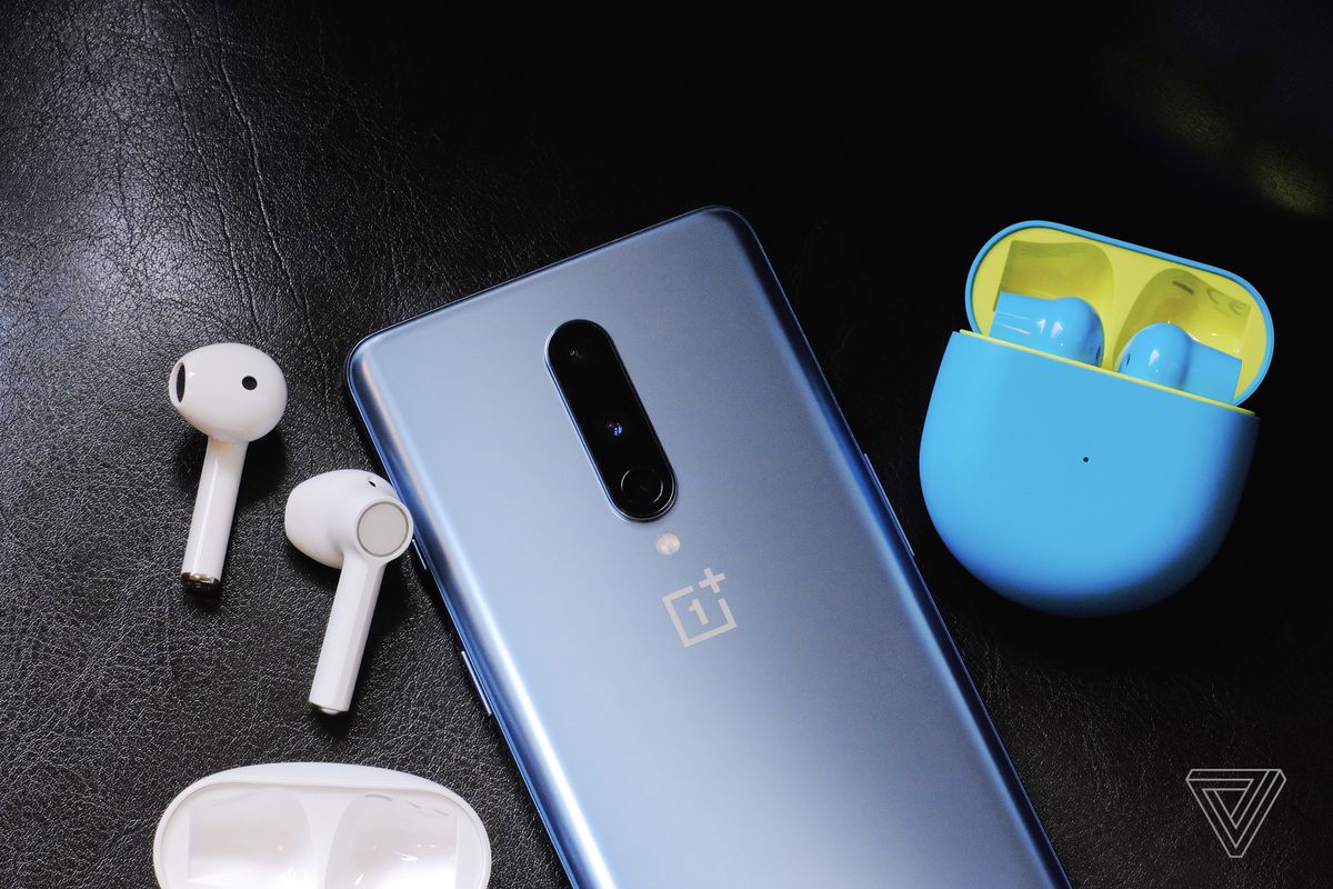 A photo of the white and blue/green OnePlus Buds.