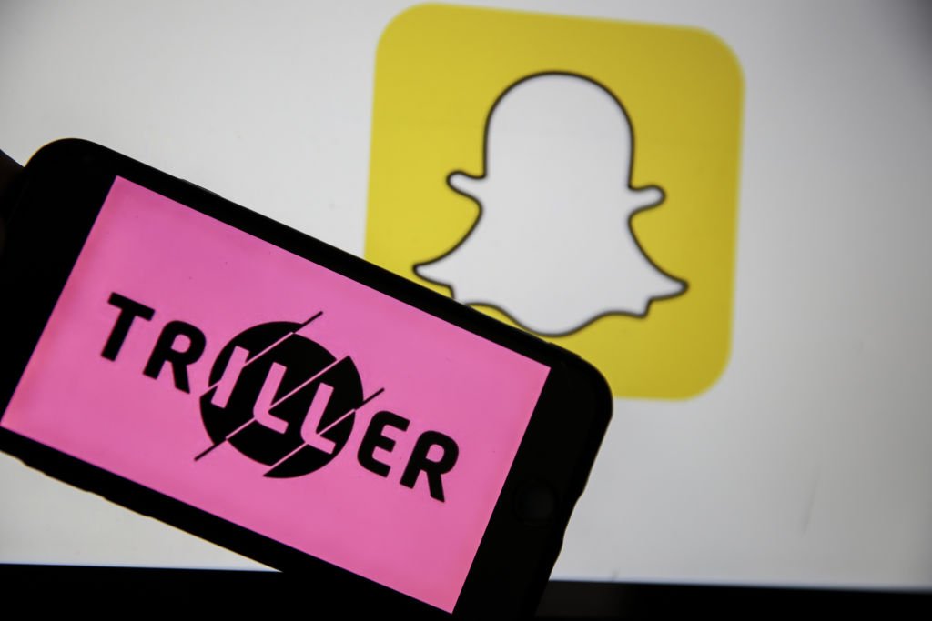 Ankara, Turkey-April 2: April 2, 2020, in Ankara, Turkey, the logo and Snapchat icon of the music video maker application Triller will appear on the phone screen.  MetinAktas / Anadolu Agency