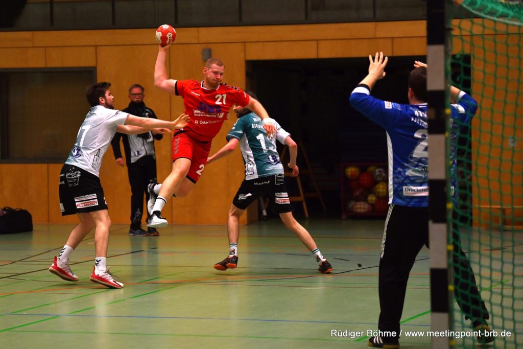 SV 63 handball player with work victory against the background of the table