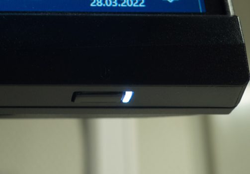 The power LED and power button are below the screen
